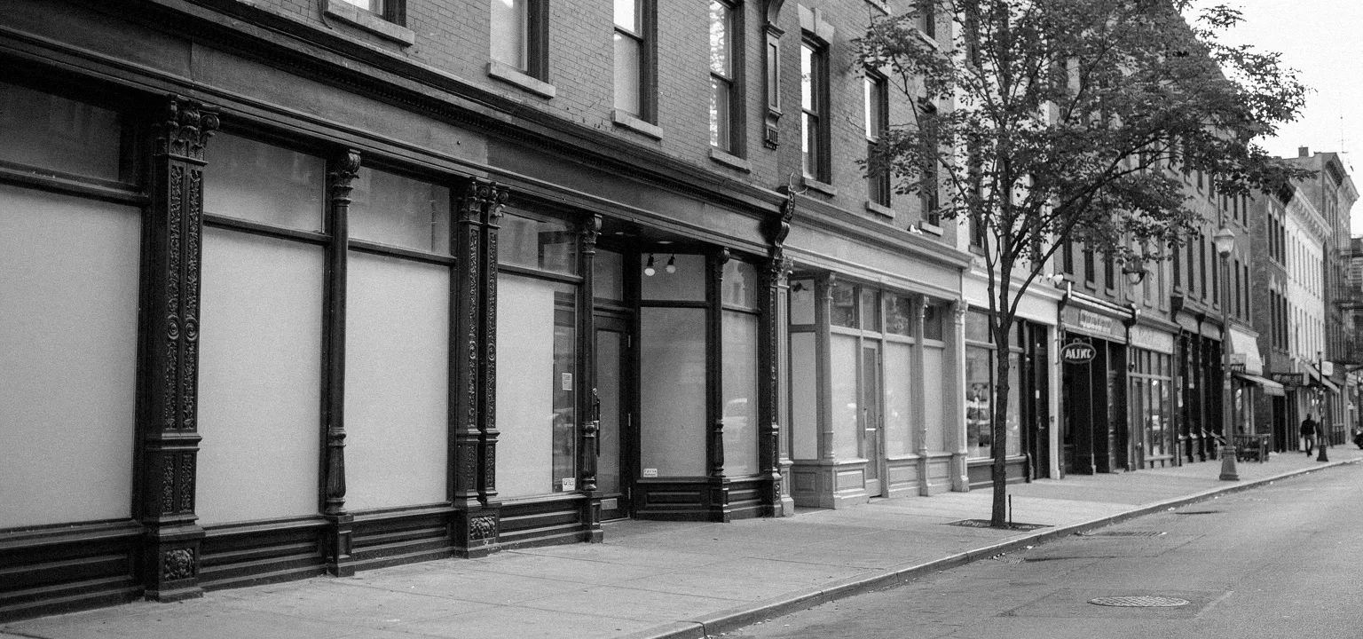 A clean row of Lower East Side retail storefronts, the market the report covers.