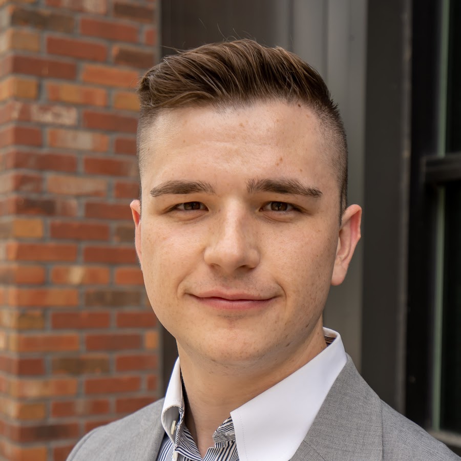 Mark Kvetkovskiy in business attire